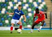 16 July 2025; Ethan McGee of Linfield in action against Mipo Odubeko of Shelbourne during the UEFA Champions League First Qualifying Round second leg match between Linfield and Shelbourne at Clearer Twist National Football Stadium at Windsor Park in Belfast. Photo by Stephen McCarthy/Sportsfile
