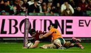 26 July 2025; Tom Curry of British & Irish Lions scores his side's second try despite the tackle of Joseph-Aukuso Suaalii of Australia during the second test match between Australia and the British & Irish Lions at the Melbourne Cricket Ground in Melbourne, Australia. Photo by Brendan Moran/Sportsfile
