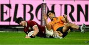 26 July 2025; Tom Curry of British & Irish Lions scores his side's second try despite the tackle of Joseph-Aukuso Suaalii of Australia during the second test match between Australia and the British & Irish Lions at the Melbourne Cricket Ground in Melbourne, Australia. Photo by Brendan Moran/Sportsfile