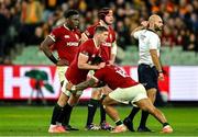 26 July 2025; Bundee Aki of British & Irish Lions stretches, assisted by Owen Farrell, left, during the second test match between Australia and the British & Irish Lions at the Melbourne Cricket Ground in Melbourne, Australia. Photo by Brendan Moran/Sportsfile