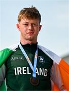26 July 2025; Joe Burke of Team Ireland poses for a portrait with his boys 200m bronze medal at Mother Teresa Square during day six of the 2025 European Youth Summer Olympic Festival in Skopje, North Macedonia. Photo by Tyler Miller/Sportsfile
