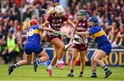 26 July 2025; Olwen Rabbitte of Galway gets through the tackles of Aoife McGrath, left, and Julieanne Bourke of Tipperary during the Glen Dimplex All-Ireland Camogie Senior Championship semi-final match between Galway and Tipperary at UPMC Nowlan Park, Kilkenny. Photo by Ben McShane/Sportsfile
