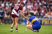 26 July 2025; Mairead Eviston of Tipperary is consoled by Niamh Niland of Galway after the Glen Dimplex All-Ireland Camogie Senior Championship semi-final match between Galway and Tipperary at UPMC Nowlan Park, Kilkenny. Photo by Ben McShane/Sportsfile
