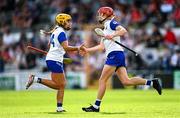 26 July 2025; Beth Carton of Waterford celebrates with teammate Niamh Rockett, left, after scoring their side's first goal during the Glen Dimplex All-Ireland Camogie Senior Championship semi-final match between Cork and Waterford at UPMC Nowlan Park, Kilkenny. Photo by Ben McShane/Sportsfile