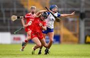 26 July 2025; Amy O'Connor of Cork is tackled by Vikki Falconer of Waterford during the Glen Dimplex All-Ireland Camogie Senior Championship semi-final match between Cork and Waterford at UPMC Nowlan Park, Kilkenny. Photo by Ben McShane/Sportsfile