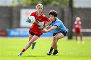 26 July 2025; Saoirse Cunningham of Cork in action against Catarina Almeida of Dublin during the ZuCar All-Ireland U18 A Ladies Football Championship final match between Cork and Dublin at Grant Heating St Brendan’s Park in Birr, Offaly. Photo by Seb Daly/Sportsfile