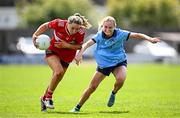 26 July 2025; Ava McAuliffe of Cork in action against Hannah Murphy of Dublin during the ZuCar All-Ireland U18 A Ladies Football Championship final match between Cork and Dublin at Grant Heating St Brendan’s Park in Birr, Offaly. Photo by Seb Daly/Sportsfile