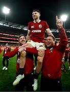26 July 2025; Winning try scorer Hugo Keenan of British & Irish Lions is lifted by teammates Mack Hansen, left, and Jamie George as they celebrate after the second test match between Australia and the British & Irish Lions at the Melbourne Cricket Ground in Melbourne, Australia. Photo by Brendan Moran/Sportsfile