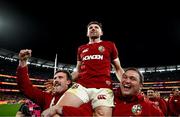 26 July 2025; Winning try scorer Hugo Keenan of British & Irish Lions is lifted by teammates Mack Hansen, left, and Jamie George as they celebrate after the second test match between Australia and the British & Irish Lions at the Melbourne Cricket Ground in Melbourne, Australia. Photo by Brendan Moran/Sportsfile