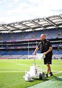 27 July 2025; Lead Groundsman Darren Jepson paints the pitch before the GAA Football All-Ireland Senior Championship final match between Kerry and Donegal at Croke Park in Dublin. Photo by Ramsey Cardy/Sportsfile