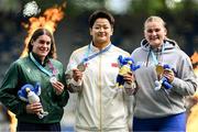 27 July 2025; Nicola Tuthill, from Kilbrittain in Cork, representing University College Dublin and Ireland, left, who finished second, celebrates with Jie Zhao of Team China, centre, who finished first, and Sara Sofia Killinen of Team Finland, who finished third, after the women's hammer throw final during day eleven of the FISU World University Games 2025 at Lohrheidestadion in Bochum, Germany. Photo by Shauna Clinton/Sportsfile