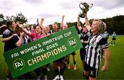 27 July 2025; Whitehall Rangers captain Charlie Graham lifts the cup alongside her teammates after the FAI Women’s Amateur Cup final match between Terenure Rangers and Whitehall Rangers at UCD Bowl in Dublin. Photo by Ben McShane/Sportsfile