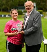 27 July 2025; Whitehall Rangers goalkeeper Lauren Davies is presented the Player of the Match award by FAI director of competitions Fran Gavin after the FAI Women’s Amateur Cup final match between Terenure Rangers and Whitehall Rangers at UCD Bowl in Dublin. Photo by Ben McShane/Sportsfile