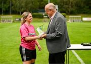 27 July 2025; Whitehall Rangers goalkeeper Lauren Davies is presented the Player of the Match award by FAI director of competitions Fran Gavin after the FAI Women’s Amateur Cup final match between Terenure Rangers and Whitehall Rangers at UCD Bowl in Dublin. Photo by Ben McShane/Sportsfile