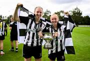27 July 2025; Lara Phipps, left, and Isabella Chambers of Whitehall Rangers celebrate with the cup after the FAI Women’s Amateur Cup final match between Terenure Rangers and Whitehall Rangers at UCD Bowl in Dublin. Photo by Ben McShane/Sportsfile