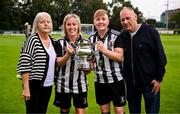 27 July 2025; Whitehall Rangers captain Charlie Graham, second from left, celebrates with the cup and her family, from left, mother Margaret, sister and teammate Natasha Graham and father Mervyn after the FAI Women’s Amateur Cup final match between Terenure Rangers and Whitehall Rangers at UCD Bowl in Dublin. Photo by Ben McShane/Sportsfile