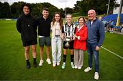 27 July 2025; Jane McKevitt of Whitehall Rangers celebrates with the cup and her family after the FAI Women’s Amateur Cup final match between Terenure Rangers and Whitehall Rangers at UCD Bowl in Dublin. Photo by Ben McShane/Sportsfile