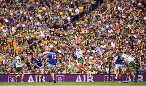 27 July 2025; David Clifford of Kerry kicks under pressure from Brendan McCole of Donegal during the GAA Football All-Ireland Senior Championship final match between Kerry and Donegal at Croke Park in Dublin. Photo by Ramsey Cardy/Sportsfile