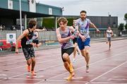 27 July 2025; The Dundrum South Dublin team, right, on their way to winning the premier men's 4x400m relay ahead of Clonliffe Harriers AC, Dublin, left, during the 123.ie National League Final at Tullamore Harriers Athletics Club in Tullamore, Offaly. Photo by Sam Barnes/Sportsfile