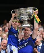 27 July 2025; Paul Geaney of Kerry and his son Paidi lift the Sam Maguire cup after the GAA Football All-Ireland Senior Championship final match between Kerry and Donegal at Croke Park in Dublin. Photo by Stephen McCarthy/Sportsfile