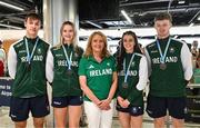 27 July 2025; Team Ireland medalists, from left, Ben Sykes, Ellis McHugh, Erin Friel and Joe Burke with Athletics Ireland president Bríd Golden upon their return to Dublin Aiport from the 2025 European Youth Summer Olympic Festival in Skopje, North Macedonia. Photo by Tyler Miller/Sportsfile