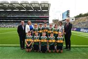 27 July 2025; Cumann na mBunscol Gary Farrell, LGFA president Trina Murray, INTO President Anne Horan, Uachtarán Chumann Lúthchleas Gael Jarlath Burns, with the Kerry team, back row, left to right, Michael Kenny, Casey Cloneen NS, Clonmel, Tipperary, Henry Hegarty, Gaelscoil Bheanntraí, Beanntraí, Co. Chorcaí, Jamie Henry, Collon NS, Collon, Louth, Keelan Sweeney, St Andrew's NS, Curragha, Meath, Nicky Hayes, Murrintown NS, Murrintown, Wexford, front row, left to right, Kevin Og Coffey, Our Lady of Mercy NS, Stradbally, Waterford, Kevin Woulfe, Scoil Naomh Iósaf, Baltinglass, Wicklow, Rogan Ó Móra, Gaelscoil an Mhuilinn, An Muileann gCearr, Iarmhí, James O'Toole, Scoil Phádraig Naofa, Tullow, Carlow, CJ Burke, St Joseph's NS, Mardyke, Cork, before the GAA INTO Cumann na mBunscol Respect Exhibition Go Games at the GAA Football All-Ireland Senior Championship final match between Kerry and Donegal at Croke Park in Dublin. Photo by Daire Brennan/Sportsfile