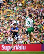 27 July 2025; Mike Breen of Kerry kicks under pressure from Donegal's Michael Langan during the GAA Football All-Ireland Senior Championship final match between Kerry and Donegal at Croke Park in Dublin. Photo by Seb Daly/Sportsfile