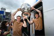 28 July 2025; Dylan Casey, left, and captain Gavin White with the Sam Maguire cup on the teams departure from Sallins & Naas Train Station in Kildare after winning the GAA Football All-Ireland Senior Championship final at Croke Park on Sunday. Photo by Ramsey Cardy/Sportsfile