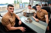 28 July 2025; Kerry players, from left, Seán O'Shea, Charlie Keating, and Dylan Casey, with the Sam Maguire cup on the teams departure from Sallins & Naas Train Station in Kildare after winning the GAA Football All-Ireland Senior Championship final at Croke Park on Sunday. Photo by Ramsey Cardy/Sportsfile