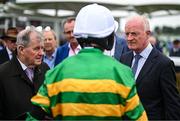 28 July 2025; Owner JP McManus and trainer Willie Mullins with Mark Walsh after the Galway Bay Hotel & Galmont Hotel Novice Hurdle during day one of the Galway Races Summer Festival at Ballybrit Racecourse in Galway. Photo by David Fitzgerald/Sportsfile