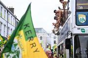 28 July 2025; The open top bus carrying the winning team drives through the streets in Tralee during homecoming celebrations for Kerry, the All-Ireland Senior Football Champions, after their victory over Donegal in the GAA Football All-Ireland Senior Championship final at Croke Park on Sunday. Photo by Piaras Ó Mídheach/Sportsfile