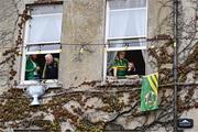 28 July 2025; Tralee residents look on from their windows during homecoming celebrations for Kerry, the All-Ireland Senior Football Champions, following their victory over Donegal in the GAA Football All-Ireland Senior Championship final at Croke Park on Sunday. Photo by Piaras Ó Mídheach/Sportsfile