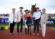 29 July 2025; Dunum with winning connections, from left, owners Mary and Maurice Burns, jockey Seamie Heffernan, groom Louis McGill and trainer Natalia Lupini after winning the COLM QUINN BMW Mile Handicap during day two of the Galway Races Summer Festival at Ballybrit Racecourse in Galway. Photo by David Fitzgerald/Sportsfile