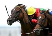 29 July 2025; Dunum, with Seamie Heffernan up, left, on their way to winning the COLM QUINN BMW Mile Handicap from second placed Bear Profit, with Nicola Burns up, during day two of the Galway Races Summer Festival at Ballybrit Racecourse in Galway.  Photo by David Fitzgerald/Sportsfile