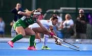 29 July 2025; Florencia Amundson of Spain is tackled by Caoimhe Perdue of Ireland during the women's hockey international match between Ireland and Spain at the Sport Ireland Campus in Dublin. Photo by Ben McShane/Sportsfile