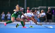 29 July 2025; Florencia Amundson of Spain is tackled by Caoimhe Perdue of Ireland during the women's hockey international match between Ireland and Spain at the Sport Ireland Campus in Dublin. Photo by Ben McShane/Sportsfile