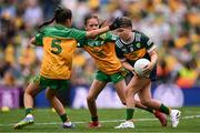 27 July 2025; Emmy Millea, St Aidan's NS, Kilmanagh, Kilkenny, representing Kerry, in action against Lucy Murphy, Breaffy NS, Breaffy, Mayo, representing Donegal, and Grace McGonigle, Gaelscoil Cois Feabhaill, Moville, Donegal, during the GAA INTO Cumann na mBunscol Respect Exhibition Go Games at the GAA Football All-Ireland Senior Championship final match between Kerry and Donegal at Croke Park in Dublin. Photo by Ramsey Cardy/Sportsfile