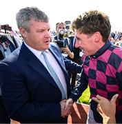 31 July 2025; Trainer Gordon Elliott, left, and jockey Jack Kennedy after sending out Ndaawi to win the Guinness Galway Hurdle Handicap during day four of the Galway Races Summer Festival at Ballybrit Racecourse in Galway. Photo by Seb Daly/Sportsfile