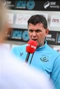1 August 2025; Drogheda United manager Kevin Doherty is interviewed by Virgin Media Sport before the SSE Airtricity Men's Premier Division match between Bohemians and Drogheda United at Dalymount Park in Dublin. Photo by Seb Daly/Sportsfile