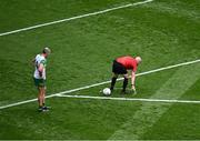 27 July 2025; Referee Brendan Cawley uses foam spray to mark the position of a free to be taken by Michael Murphy of Donegal during the GAA Football All-Ireland Senior Championship final match between Kerry and Donegal at Croke Park in Dublin. Photo by Piaras Ó Mídheach/Sportsfile