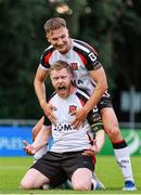 1 August 2025; Daryl Horgan of Dundalk, front, celebrates with teammate John Ross Wilson after scoring his side's first goal, a penalty, during the SSE Airtricity Men's First Division match between UCD and Dundalk at UCD Bowl in Belfield, Dublin. Photo by Thomas Flinkow/Sportsfile