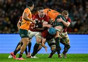 2 August 2025; Harry Wilson of Australia is tackled by British & Irish Lions players, from left, Jack Conan, Tadhg Beirne and Jac Morgan during the third test match between Australia and the British & Irish Lions at Accor Stadium in Sydney, Australia. Photo by Brendan Moran/Sportsfile