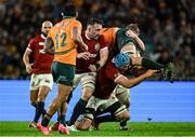 2 August 2025; Harry Wilson of Australia is tackled by British & Irish Lions players, from left, Jack Conan, Tadhg Beirne and Jac Morgan during the third test match between Australia and the British & Irish Lions at Accor Stadium in Sydney, Australia. Photo by Brendan Moran/Sportsfile