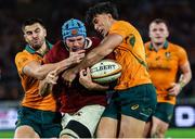 2 August 2025; Tadhg Beirne of British & Irish Lions is tackled by Tom Wright, left, and Joseph-Aukuso Suaalii of Australia during the third test match between Australia and the British & Irish Lions at Accor Stadium in Sydney, Australia. Photo by Steve Christo/Sportsfile