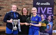 2 August 2025; LGFA President Trina Murray presents Robyn Whyte, left, and Una Kerrins-Morrissey of Ballymacelligott, Kerry, with the Junior Championship winners trophy at the O’Neills All-Ireland Club 7s competitions at Naomh Mearnóg GAA Club in Portmarnock, Dublin. Photo by Piaras Ó Mídheach/Sportsfile