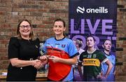 2 August 2025; LGFA President Trina Murray presents Lara Finnegan of Tuam Cortoon, Galway, with the Intermediate Championship runners-up trophy at the O’Neills All-Ireland Club 7s competitions at Naomh Mearnóg GAA Club in Portmarnock, Dublin. Photo by Piaras Ó Mídheach/Sportsfile