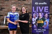 2 August 2025; LGFA President Trina Murray presents Heather Spillane of Fethard, Tipperary, with the Senior Shield runners-up trophy at the O’Neills All-Ireland Club 7s competitions at Naomh Mearnóg GAA Club in Portmarnock, Dublin. Photo by Piaras Ó Mídheach/Sportsfile