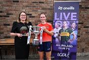 2 August 2025; LGFA President Trina Murray presents Rosemary Courtney of Donaghmoyne, Monaghan with the Senior Championship winners trophy at the O’Neills All-Ireland Club 7s competitions at Naomh Mearnóg GAA Club in Portmarnock, Dublin. Photo by Piaras Ó Mídheach/Sportsfile