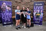 2 August 2025; LGFA President Trina Murray presents Kirsty Crotty-Ryan, left, and Orla Burke of Moyle Rovers, Tipperary, with the Senior Shield winners trophy at the O’Neills All-Ireland Club 7s competitions at Naomh Mearnóg GAA Club in Portmarnock, Dublin. Photo by Piaras Ó Mídheach/Sportsfile