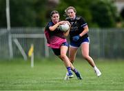 2 August 2025; Eva Donnellan of St Manchan's, Offaly, left, in action against Cumann Pheadair Naofa, Down, in the Intermediate competition at the O’Neills All-Ireland Club 7s competitions at Naomh Mearnóg GAA Club in Portmarnock, Dublin. Photo by Piaras Ó Mídheach/Sportsfile
